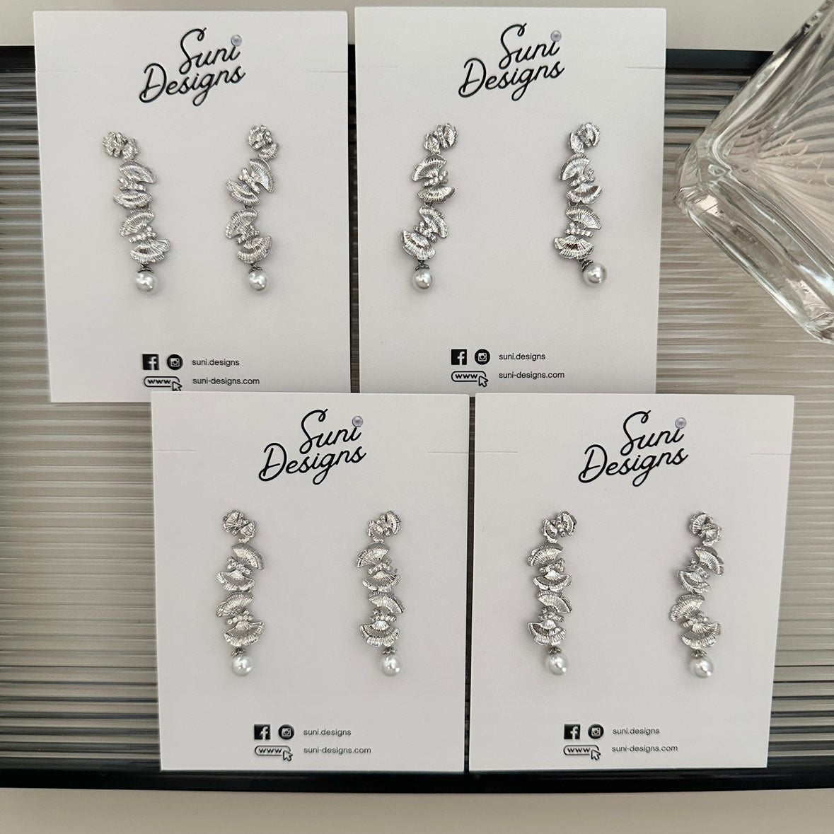 E18 Radiant Butterfly Pearl Earrings