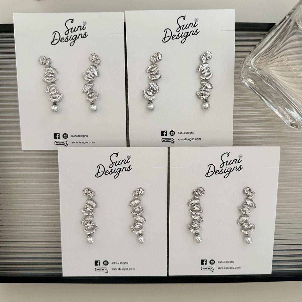 E18 Radiant Butterfly Pearl Earrings