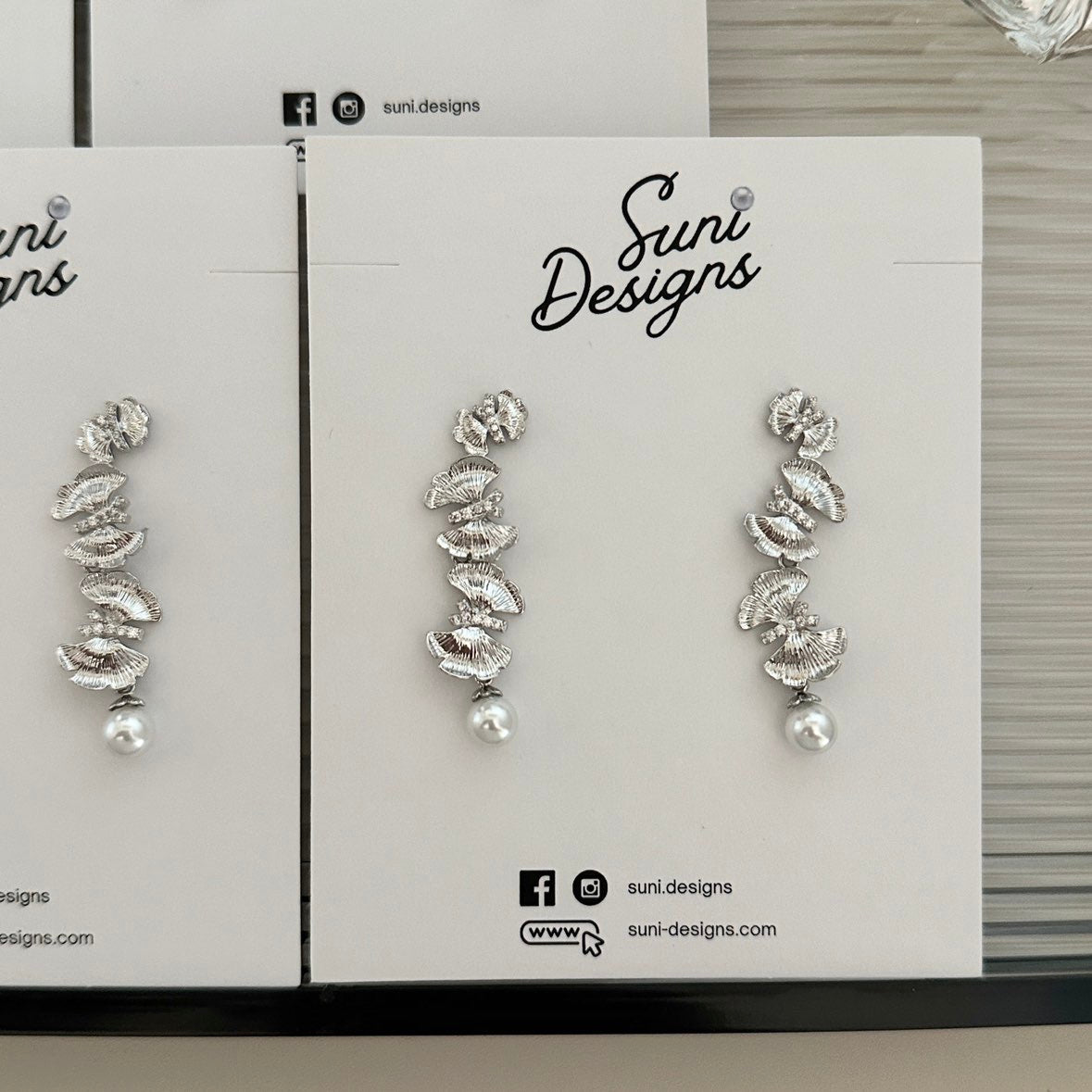 E18 Radiant Butterfly Pearl Earrings
