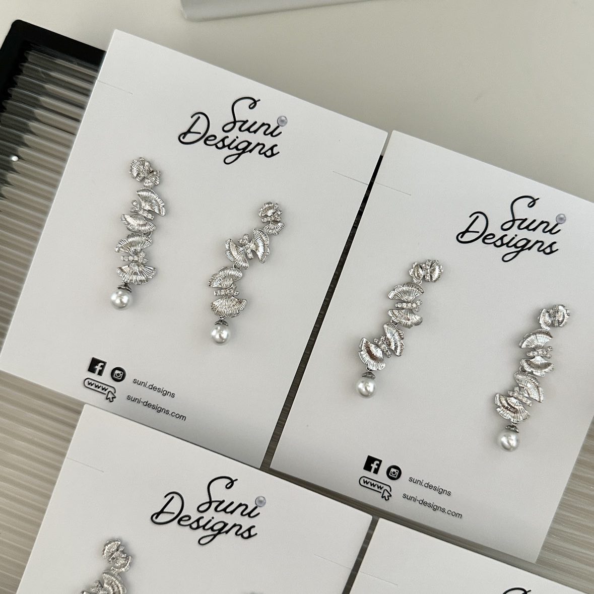 E18 Radiant Butterfly Pearl Earrings