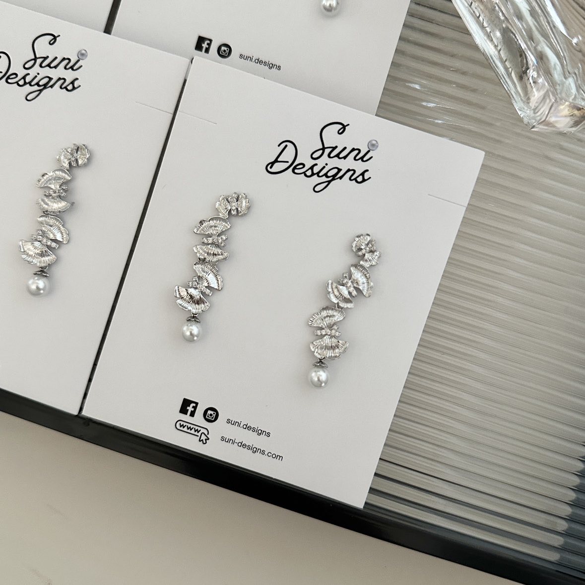 E18 Radiant Butterfly Pearl Earrings